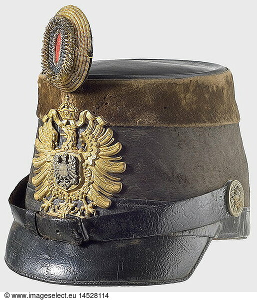 A shako for a customs official  circa 1880. Black mohair felt body  leather top  strap  and peak. A brown velvet band around the upper edge. Gilded imperial eagle plate with a seperate inescutcheon eagle overlay  Leather chinstraps on rosette buttons. Gold-black-red officer's field badge. (Feldzeichen). Lining missing. historic  historical  19th century  German Empire  Germany  Imperial  object  objects  stills  clipping  cut out  cut-out  cut-outs  militaria  weapon  arms  weapons  arms  uniform  piece  pieces