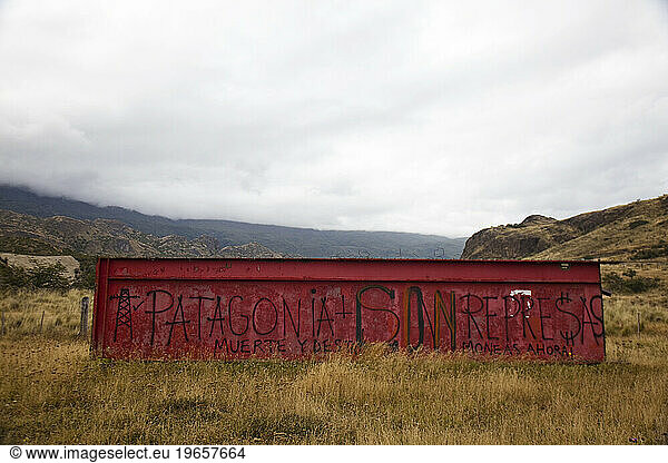 A sign says 'Patagonia Sin Represas' or Patagonia Without Dams.