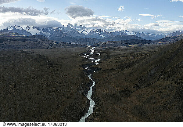A small river winds its way out of the Patagonian mountains.