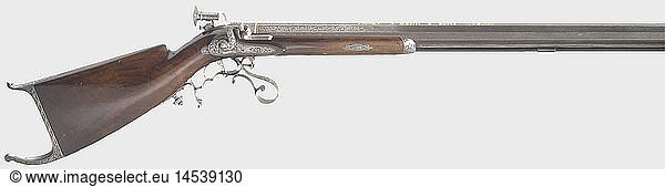 A splendid percussion target rifle  J. KÃ¤stli at Paris  circa 1840. Heavy octagonal barrel with a bright  seven-groove rifled bore in 10 mm calibre. The signature  'J. KÃ¤stli a Paris' is inlaid in gold on top of the barrel  and there is richly engraved rocaille and vine ornamentation on the breech and near the muzzle. Finely engraved and cut tang with a dismountable engraved micrometer aperture sight. Lavishly cut and engraved percussion lock with an additional signature. Vent with platinum bushing. Double set trigger. Lightly carved stock of beautifully figured walnut with a vacant silver escutcheon. Iron furniture richly covered with engraving  the bottom of the forearm is lightly pitted. Trigger guard bears the engraved monogram 'WB'. Inserted ramrod with brass tip. Length 128 cm. Johannes Kaspar KÃ¤stli (1814 - 1890) was active in St. Gallen and Paris. Cf. StÃ¶ckel  p. 608. historic  historical  19th century  civil long guns  gun  weapons  arms  weapon  arm  firearm  fire arm  gun  fire arms  firearms  guns  object  objects  stills  clipping  clippings  cut out  cut-out  cut-outs