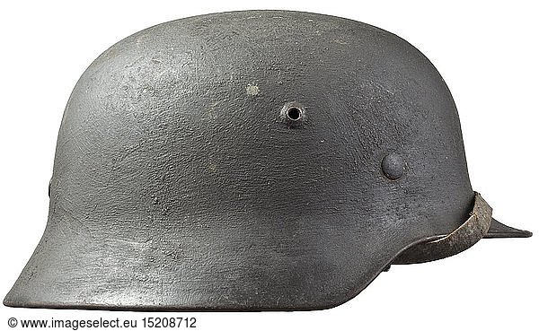 A steel helmet M 35 for Kriegsmarine personnel Steel skull with field-grey rough camouflage paint  maker's stamps 'SE64' (Saxon Enamel Works) and '3244'  of the gold-coloured eagle shield about 95% intact. Complete inner liner (foxed) with chinstrap. historic  historical  navy  naval forces  military  militaria  branch of service  branches of service  armed forces  armed service  object  objects  stills  clipping  clippings  cut out  cut-out  cut-outs  20th century