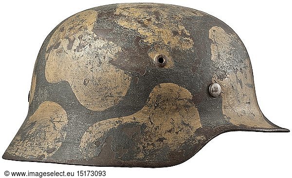 A steel helmet M 35 for members of the coastal artillery The steel skull with separate green and ochre-coloured camouflage paint above the field-grey original paint  complete with inner liner and chinstrap. historic  historical  navy  naval forces  military  militaria  branch of service  branches of service  armed forces  armed service  object  objects  stills  clipping  clippings  cut out  cut-out  cut-outs  20th century