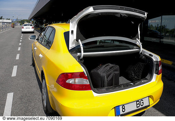 A taxi at Tallinn airport. Open trunk with luggage.