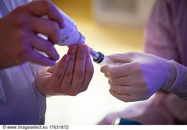 A team prepares a feeding tube for a premature baby.