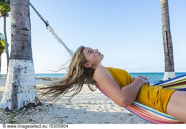 A teenage girl resting in hammock