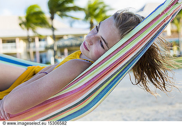 A teenage girl resting in hammock