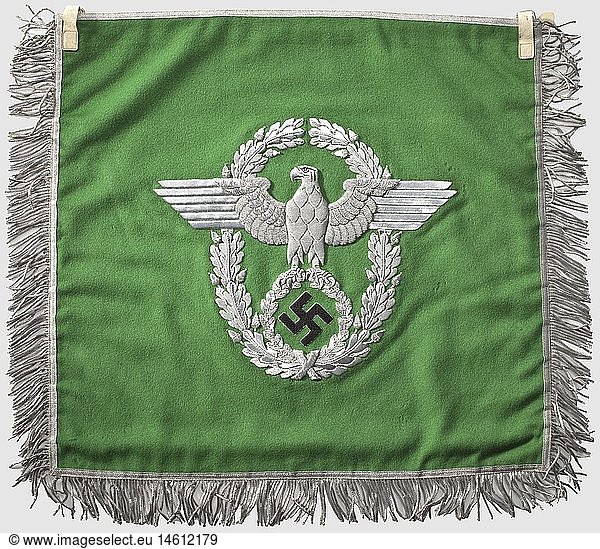 A trumpet banner  for the uniformed police Fine  light-green cloth with police-eagle embroidered in silver and swastika embroidered in black on both sides  silver borders  fringed on three sides  two fastening loops made of white leather. Fresh colours  minimal damages by moths. 44 x 47 cm  historic  historical  1930s  1930s  20th century  insignia  symbols  symbol  emblem  emblems  flag  flags  banner  banners  object  objects  stills  clipping  clippings  cut out  cut-out  cut-outs