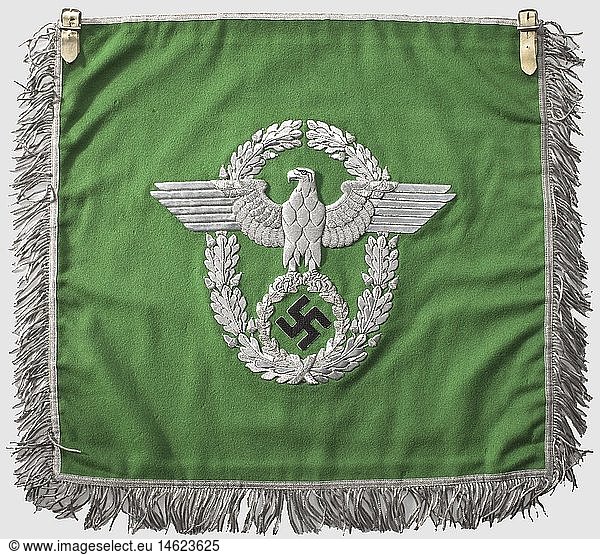 A trumpet banner  for the uniformed police Fine  light-green cloth with police-eagle embroidered in silver and swastika embroidered in black on both sides  silver borders  fringed on three sides  two fastening loops made of white leather. Fresh colours  minimal damages by moths. 44 x 47 cm  historic  historical  1930s  1930s  20th century  insignia  symbols  symbol  emblem  emblems  flag  flags  banner  banners  object  objects  stills  clipping  clippings  cut out  cut-out  cut-outs
