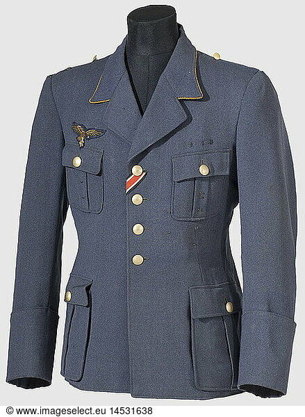 A tunic for a Generalmajor.  Luftwaffe blue gabardine with golden buttons and collar piping  gold-embroidered (bicolour) chest eagle  medal loops  Iron Cross buttonhole ribbon  and black silk lining. The shoulder straps have been removed. A pair of collar patches and white stripes for the trousers are present but loose. historic  historical  1930s  1930s  20th century  Air Force  branch of service  branches of service  armed service  armed services  military  militaria  air forces  object  objects  stills  clipping  clippings  cut out  cut-out  cut-outs  uniform  uniforms  clothes  outfit  outfits  textile