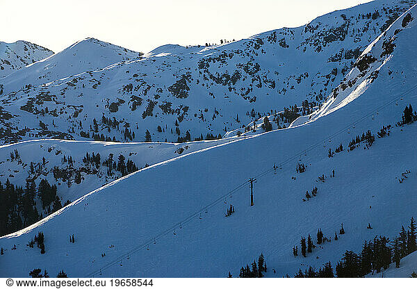 A view looking out over the ski terrain at Kirkwood Mountain Resort at sunrise in Kirkwood  California.