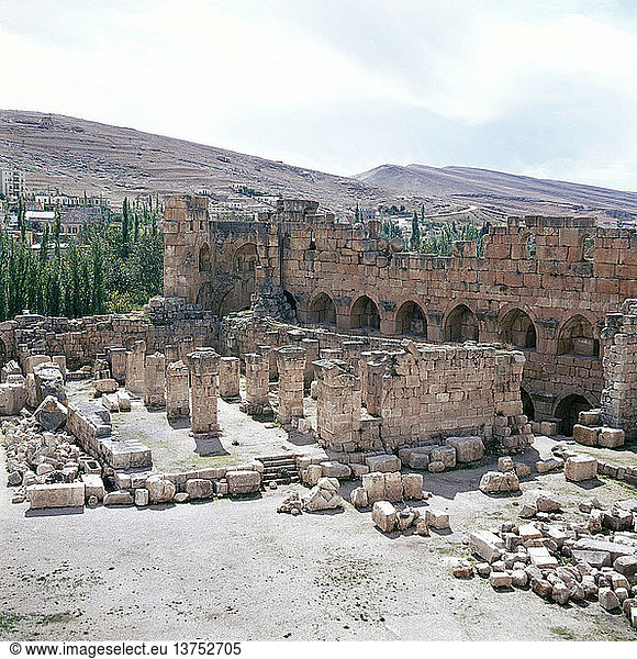 A view towards the temple precinct of Baalbek  the ancient Heliopolis which rose to prominence during the later Hellenistic and Roman period  The temples are devoted to the cult of the triad of divinities  Jupiter (Baal)  Venus (Aphrodite)  and Mercury (Hermes). Roman. 1st century AD. Baalbeck  Lebanon.