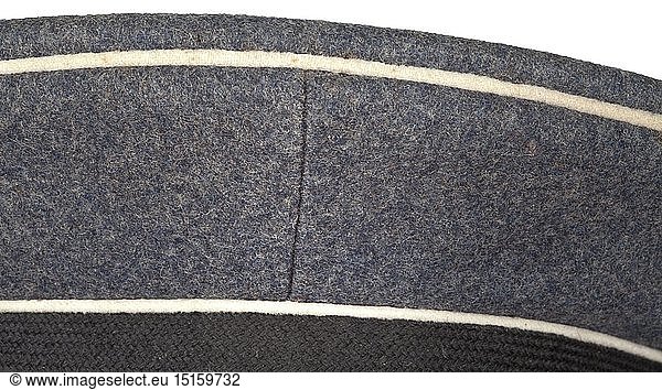 A visor cap for enlisted men/NCOs in regiment 'General GÃ¶ring' Depot piece in Luftwaffe-grey cloth  trim band of black mohair  white piping  the brown inner liner with depot stampings 'I/Gen.GÃ¶ring'  '8.Battr.'  the leather sweatband identically labelled (also with '1936')  beneath the cap trapezoid 'Robert Lubstein... Lieferjahr 1936'  aluminium insignia (the eagle in early form)  black patent leather straps. In lightly used condition. historic  historical  Air Force  branch of service  branches of service  armed service  armed services  military  militaria  air forces  object  objects  stills  clipping  clippings  cut out  cut-out  cut-outs  20th century