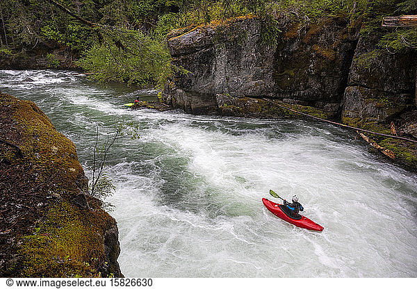 A white water kayaker paddles down the Cheakamus River in Whistler.