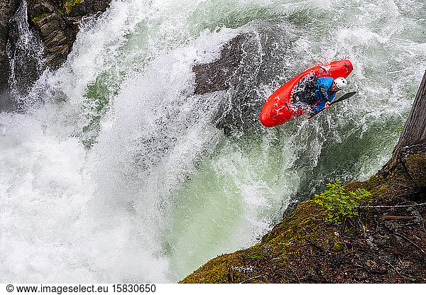 A white water kayaker paddles down the Cheakamus River in Whistler.