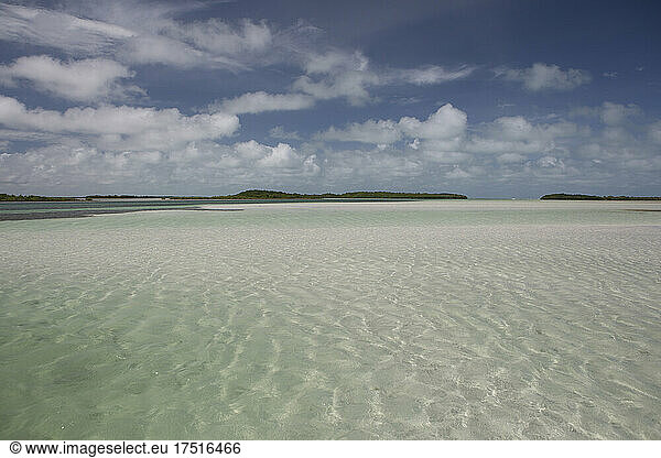 A wide angle view of shallow clear water flats and blue skies in keys