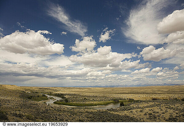 A winding river glides through the sage brush of the Wind River Range in Wyoming.