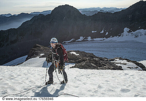A woman climbing the Blue Glacier Route on Mount Olympus