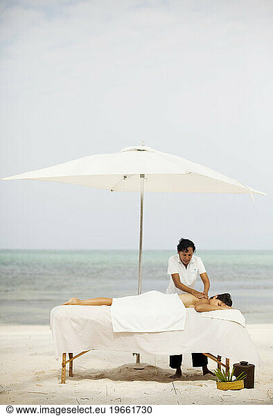 A woman get a message while on vacation at the beach.