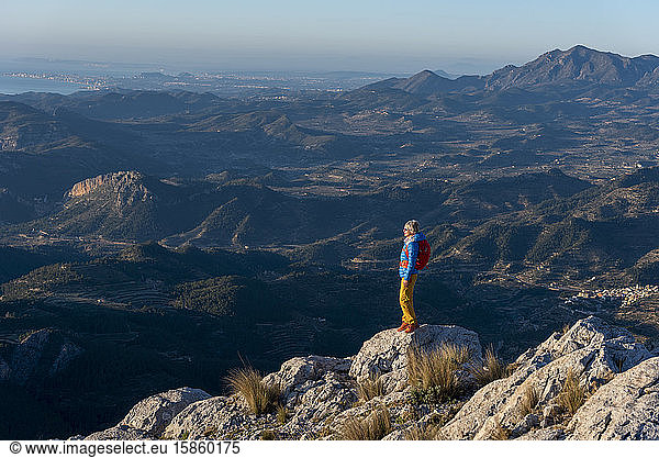 A woman hiking in the high country  Costa Blanca  El Divino mountain.