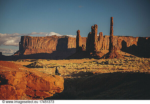 A woman is meditating in Monument Valley  Arizona