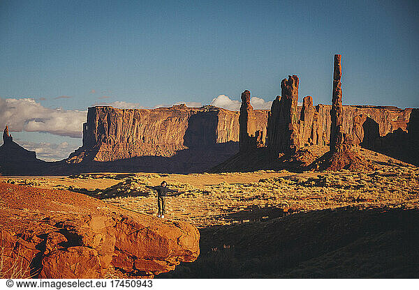 A woman is standing in Monument Valley  Arizona
