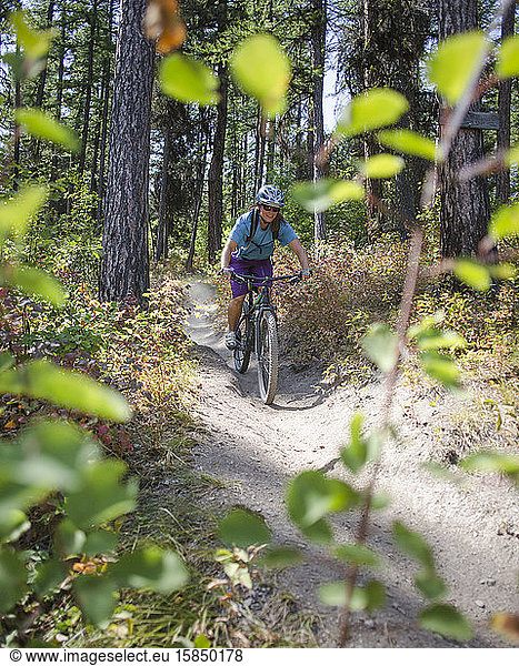 A woman mountain biker near Missoula  Montana.