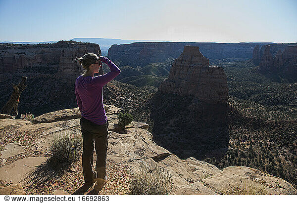 A woman overlooks Colorado National Monument in Colorado.