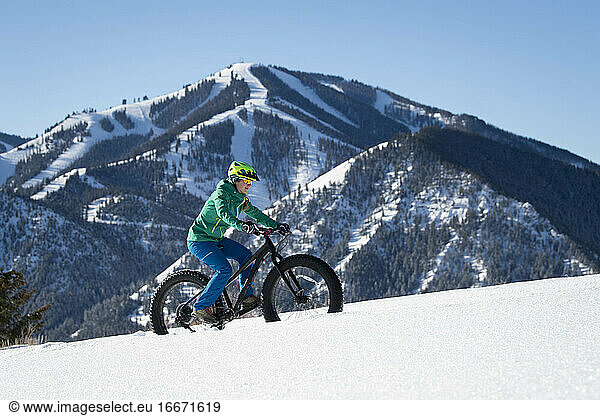 A woman riding her fat bike on a beautiful winter day in Sun Valley.