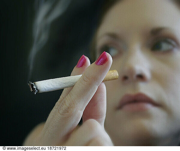 A woman smokes a cigarette  Nashville  Tennessee.
