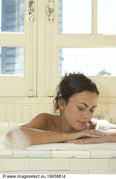 A woman taking a bath.