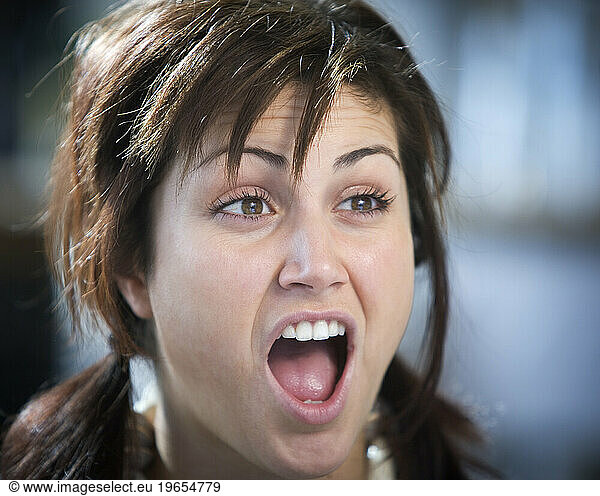 A woman with a suprised look on her face.