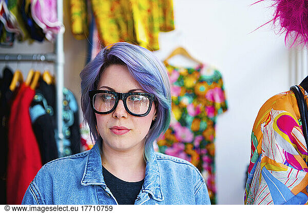 A Woman With Purple Hair And Bold Eyeglasses Shops At Portobello Market  Notting Hill; London  England