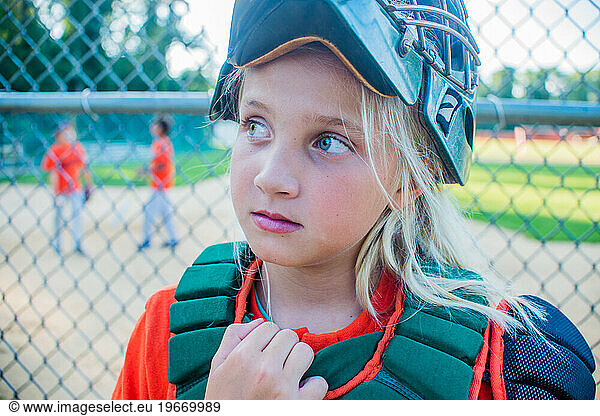 A 10 year old girl catcher on the baseball team