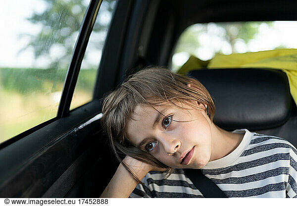 A young boy taking a car ride