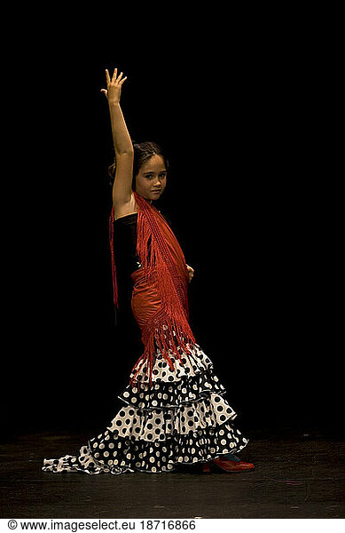 A young girl poses for a portrait as she practices Flamenco during a class in Prado del Rey  Cadiz province  Andalusia  Spain.