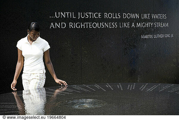 A young woman enjoys the displays outside the Civil Rights Museum in Montgomery  AL.