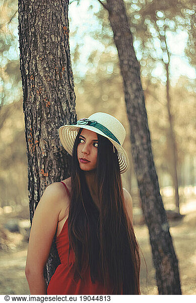 A young woman spending time in a forest