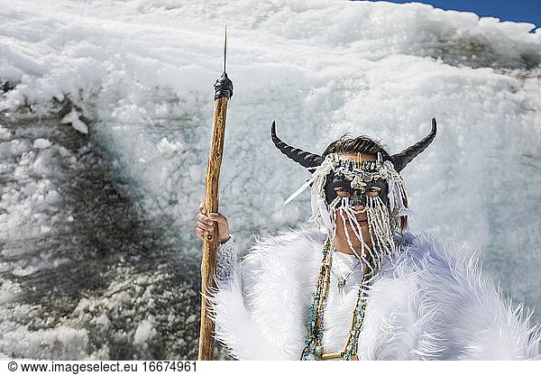 Aboriginal girl wearing face mask  dressed as mountain goat.