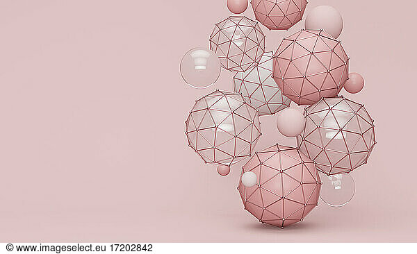 Abstrakte Polyederformen vor rosa Hintergrund
