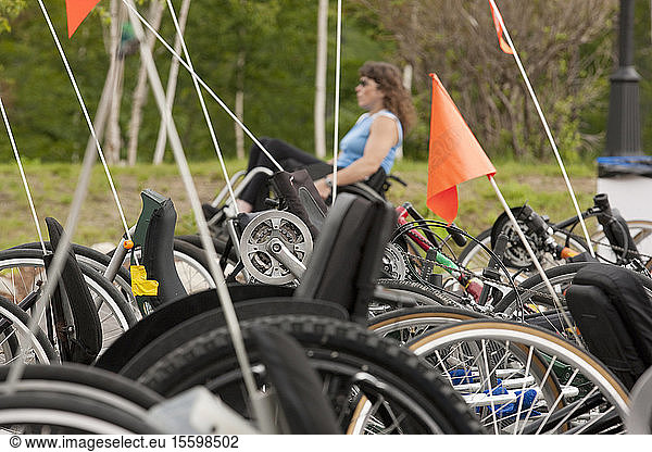 Accessible racing bikes and a woman with spinal cord injury in a wheelchair