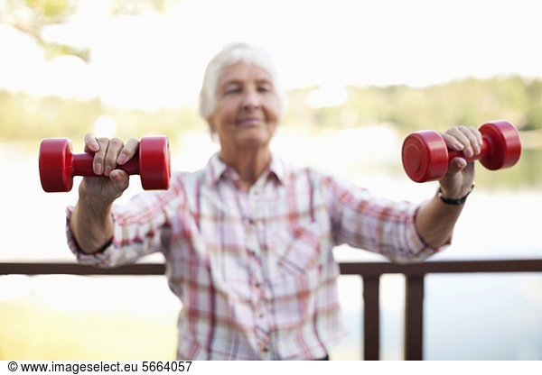 Active elderly woman exercising outdoors