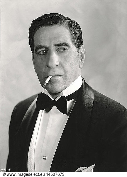 Actor Robert Warwick  Head and Shoulders Publicity Portrait Wearing Tuxedo and Smoking Cigarette  1930's