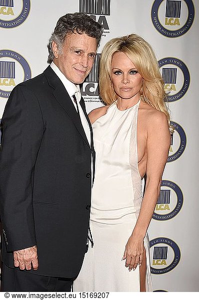 Actress Pamela Anderson (R) and Last Chance for Animals president & founder Chris DeRose attend the Last Chance for Animals Benefit Gala at The Beverly Hilton Hotel on October 24  2015 in Beverly Hills  California.