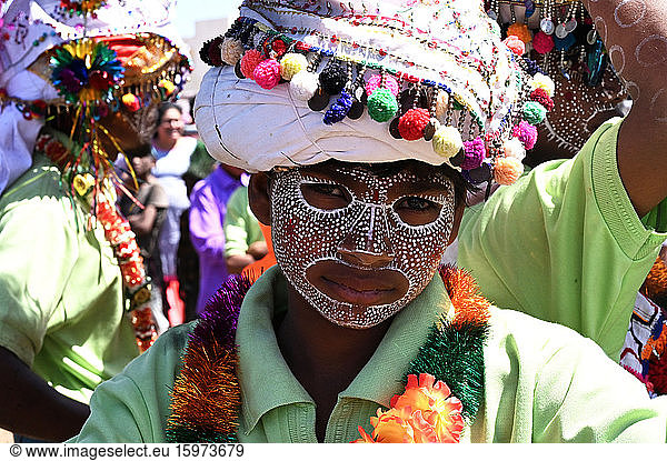 Adivasi tribal man  face decorated and wearing ornate decorated headgear to celebrate Holi festival  Kavant  Gujarat  India  Asia