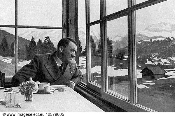 Adolf Hitler admiring the view out a window near Garmisch  Bavaria  Germany  1936. Artist: Unknown