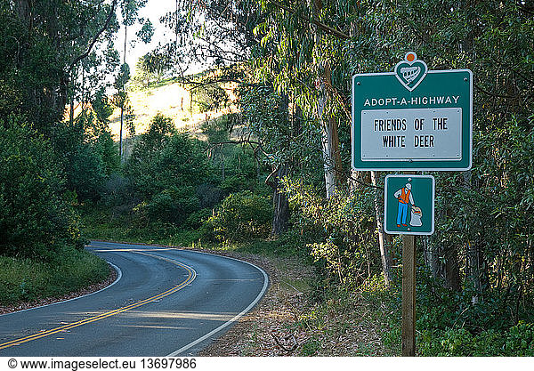 Adopt-a-Highway sign on State Highway 1 in Marin County  California. Friends Of The White Deer is an organization opposed to the National Park Service's plans to eliminate non-native Fallow and Axis Deer from Point Reyes National Seashore.