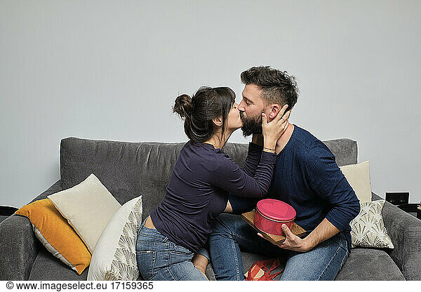Adult couple exchanging gifts on Valentines Day