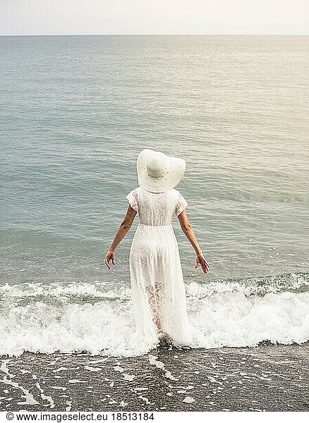 Adult woman wearing a white dress