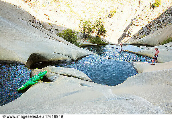 Adventurers explore the Seven Teacups in the Sierra Nevada mountains.