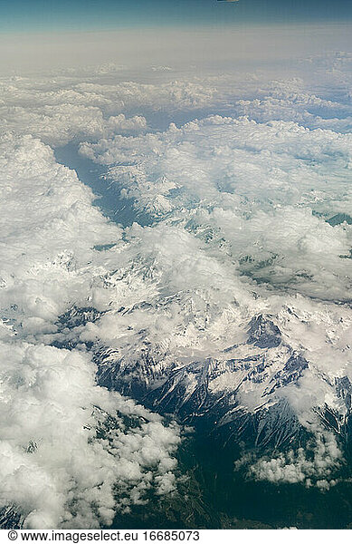 Aerial of the alps from airplane covered with snow
